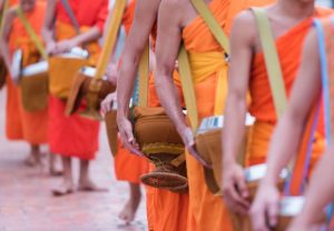 Monks carrying bowls